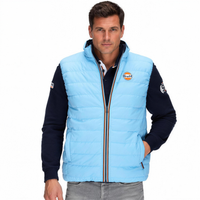 Gulf Reversible Puffer Vest in Gulf Blue, hand in pocket