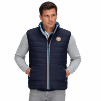 Gulf Reversible Puffer Vest in Navy, hands in pockets