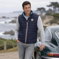 Gulf Reversible Puffer Vest in Navy, lifestyle shot at Pebble Beach